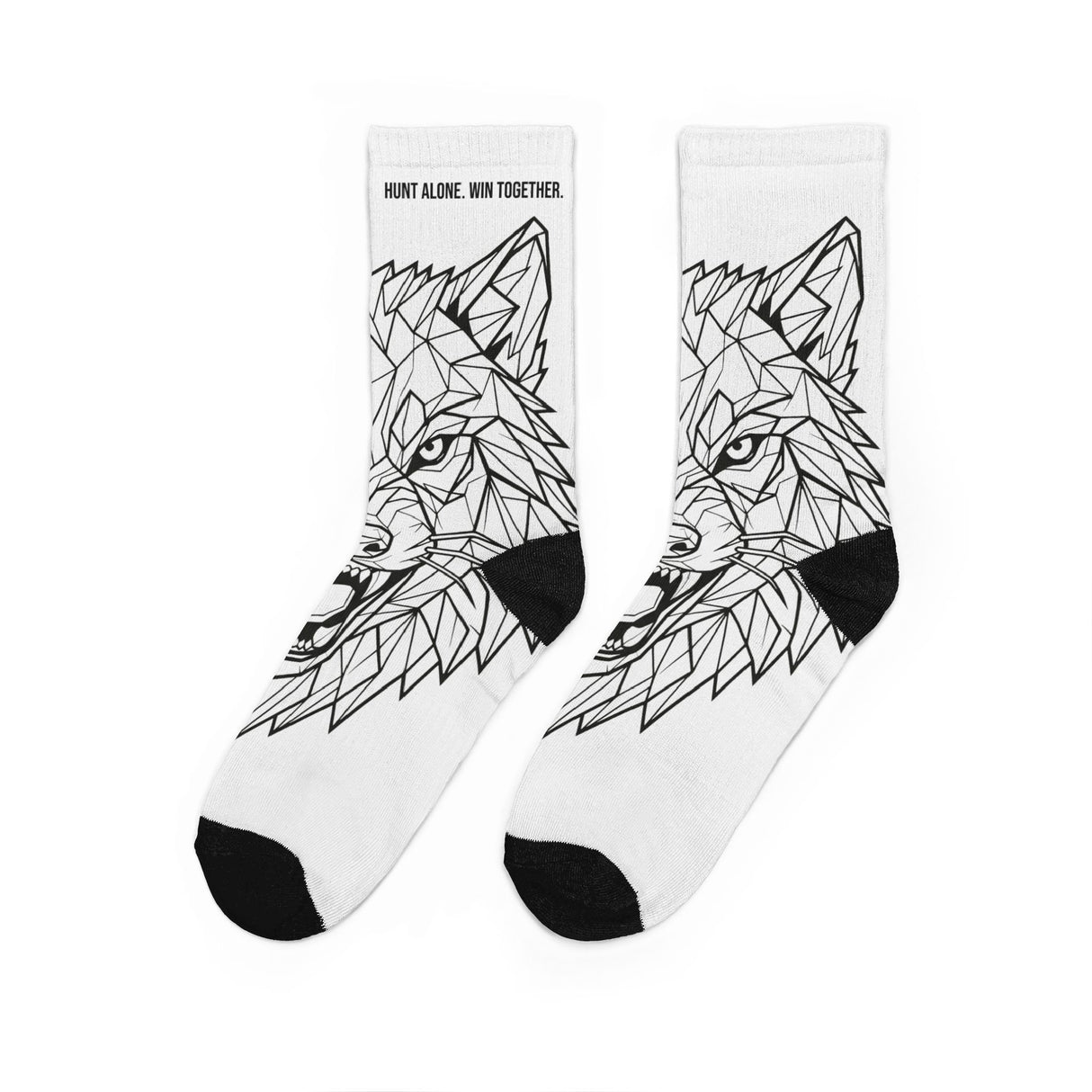 White socks with black geometric wolf design on a white background