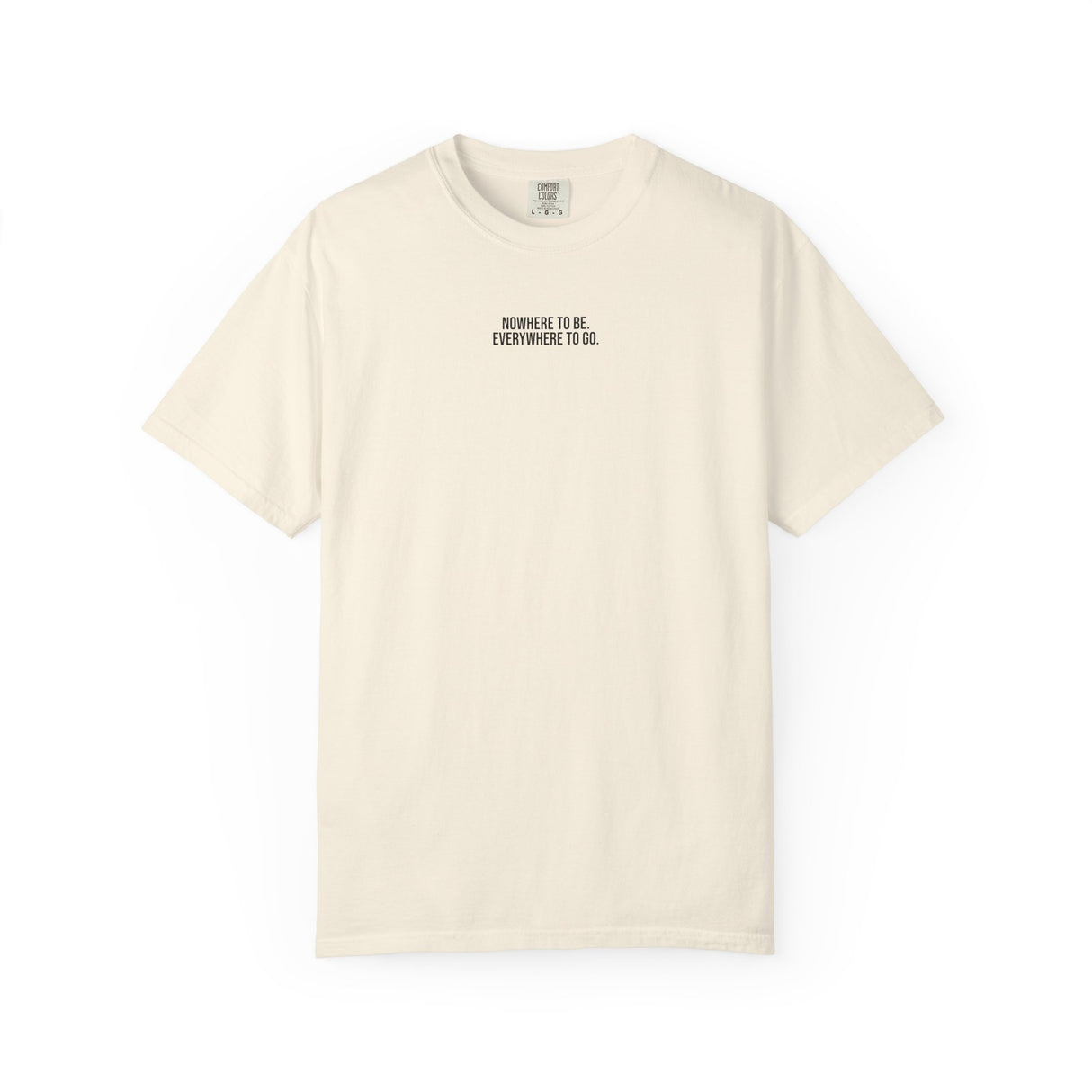 Printify Road Trip T-shirt from the Nature Series featuring the quote "Nowhere to Be. Everywhere to Go" displayed on a casual tee.