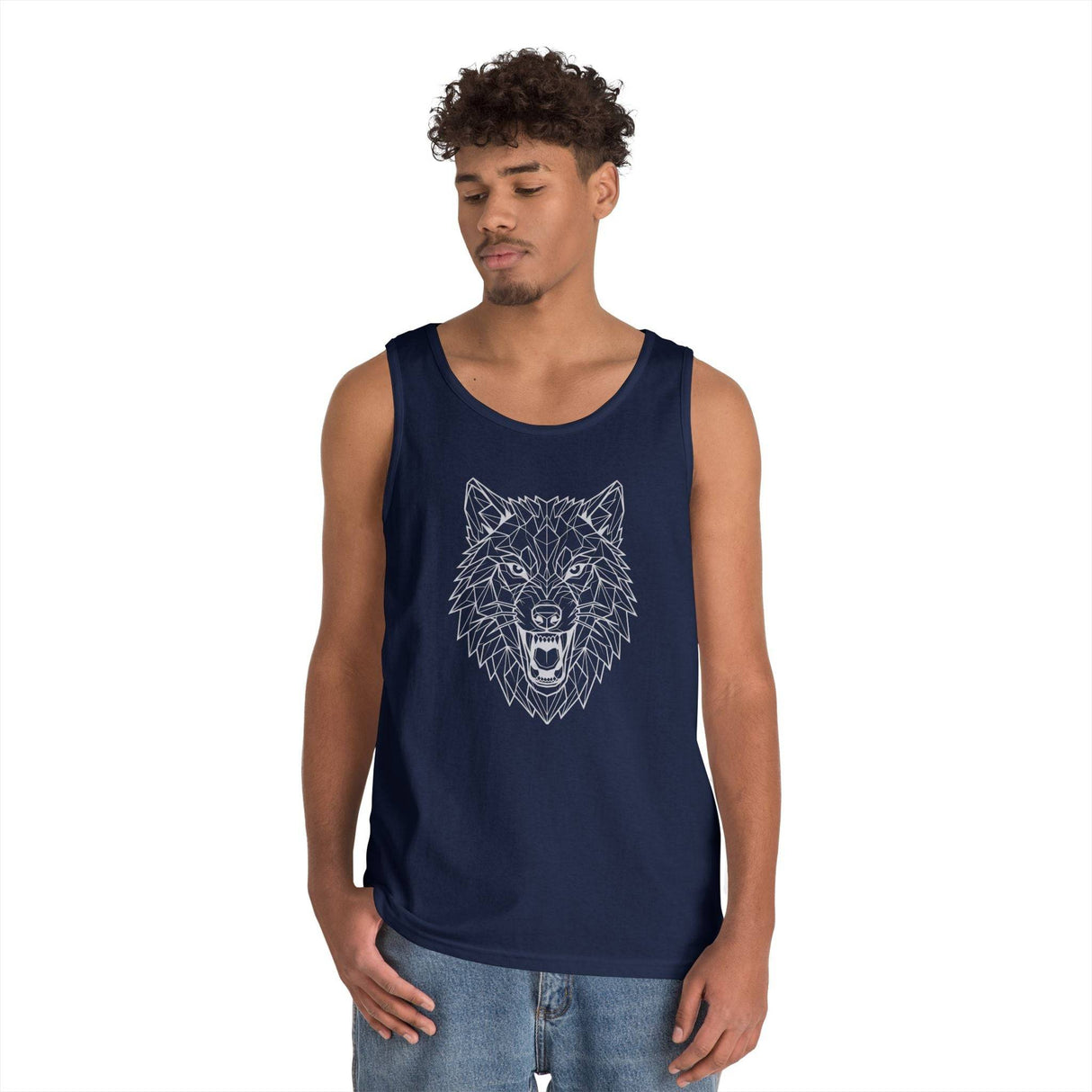 Young man wearing a navy blue tank top featuring a geometric, line-art design of an aggressive wolf head. The modern sleeveless shirt pairs with casual denim jeans, highlighting urban and stylish streetwear fashion. | PicSEO 1776477035604