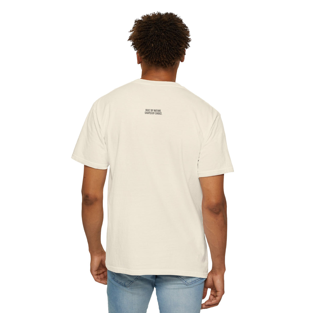 Printify Mountain Tee T-shirt featuring "Built by Nature. Shaped by Choice." design from the Nature Series, shown on a model.