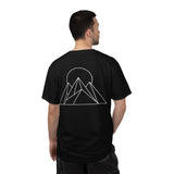 Printify Peak Tee T-shirt from the Nature Series featuring a "Built to Rise" design, shown in a natural outdoor setting.