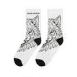 White socks with black geometric wolf design on a white background