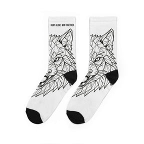 White socks with black geometric wolf design on a white background
