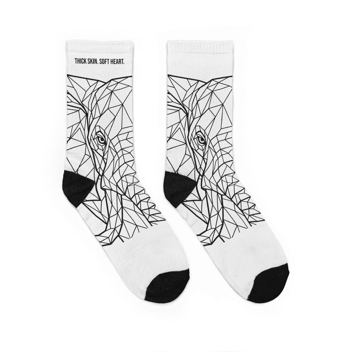White socks with black geometric wolf design on a white background