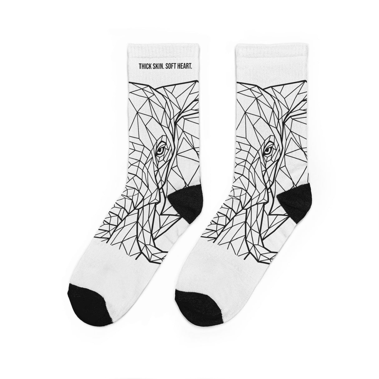 White socks with black geometric wolf design on a white background