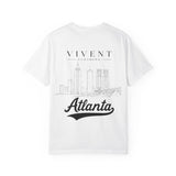 White t-shirt with 'Vivent Clothing' and 'Atlanta' text on a white background