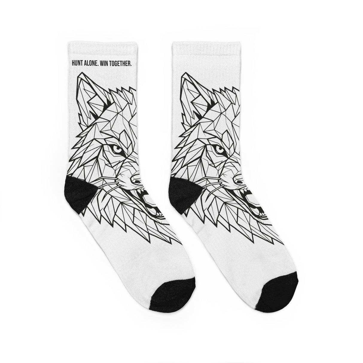 White socks with black geometric wolf design on a white background