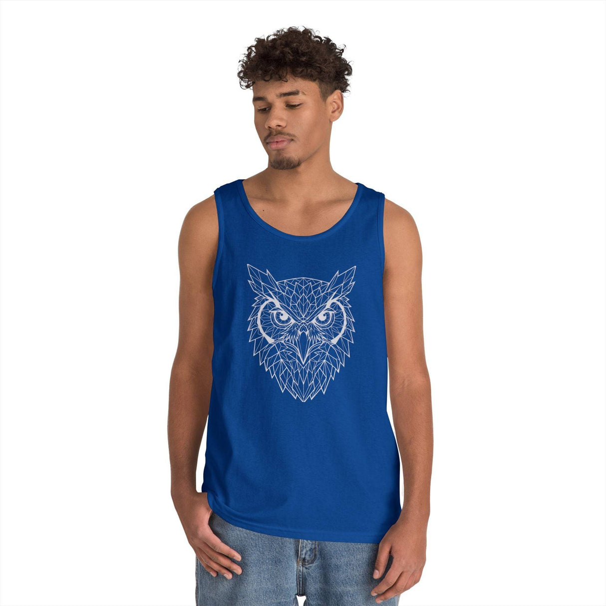Young man wearing a blue sleeveless tank top featuring a geometric owl design in white lines, paired with casual denim jeans, set against a plain white background. | PicSEO 1776476593079