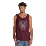 A young man wearing a maroon tank top featuring a geometric owl face design, paired with casual blue jeans. The sleeveless shirt highlights a modern, angular owl graphic in white lines, offering a bold and stylish look suitable for casual wear. | PicSEO 1776476513310