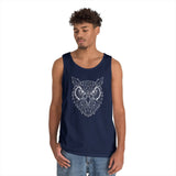 Young man wearing a navy blue tank top featuring a geometric owl design in white lines, paired with light blue denim jeans, standing against a plain white background. | PicSEO 1776476634072