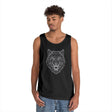 Black sleeveless tank top featuring a geometric, angular wolf head design in white lines, worn by a young man with curly hair and casual blue jeans, set against a plain white background. | PicSEO 1776476828556
