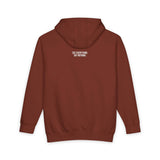 Back view of a rust-colored hoodie featuring a minimalist design with the bold white text "SEE EVERYTHING. SAY NOTHING." printed on the upper back, showcasing a modern and understated style. | PicSEO 1776477978752