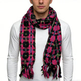 A stylish close-up of a man wearing a vibrant woven scarf with a bold geometric pattern in pink, black, and green tones, paired with a plain white long-sleeve shirt, showcasing a cozy and fashionable winter accessory. | PicSEO 1775591661754